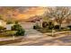 Inviting single-story home with an attached two-car garage, complemented by a well-manicured front yard and beautiful landscaping at 4706 Cayo Costa Pl, Bradenton, FL 34203