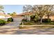 Charming one-story home featuring a manicured lawn and attached two-car garage at 4706 Cayo Costa Pl, Bradenton, FL 34203
