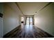 Spacious living room featuring wood floors, neutral paint, and access to the backyard patio at 4706 Cayo Costa Pl, Bradenton, FL 34203