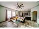 Open concept living room with view into updated kitchen, lots of natural light at 4706 Cayo Costa Pl, Bradenton, FL 34203