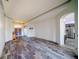 Spacious living room featuring wood floors, neutral paint, and an open floor plan to the kitchen at 4706 Cayo Costa Pl, Bradenton, FL 34203