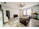 Spacious living room featuring modern floors and an oversized ceiling fan at 4706 Cayo Costa Pl, Bradenton, FL 34203