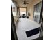 Enclosed patio with sliding glass doors and a ceiling fan, ideal for outdoor relaxation and entertaining at 4706 Cayo Costa Pl, Bradenton, FL 34203