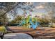 Community playground with climbing features, slides, and shaded seating areas at 4706 Cayo Costa Pl, Bradenton, FL 34203