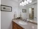 Bright bathroom featuring a large mirror, neutral countertops and an updated faucet at 500 Halyard Ln, Longboat Key, FL 34228
