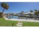 Dock with boat lift and views of waterfront homes and canals in a coastal neighborhood at 500 Halyard Ln, Longboat Key, FL 34228