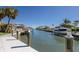 Beautiful waterfront view from the private dock with boats and coastal neighborhood at 500 Halyard Ln, Longboat Key, FL 34228