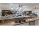 Open kitchen and living area, with granite countertops, skylights and views of the waterfront pool at 500 Halyard Ln, Longboat Key, FL 34228