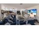 Bright living room with blue sectional sofa and seamless indoor-outdoor living at 500 Halyard Ln, Longboat Key, FL 34228