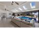 Bright living room with skylights, tile floors, and views of the pool and waterfront at 500 Halyard Ln, Longboat Key, FL 34228