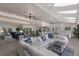 Spacious open-concept living room with skylights, tile floors, and elegant furnishings at 500 Halyard Ln, Longboat Key, FL 34228
