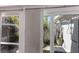 Outdoor shower area featuring wood slats and a tile surround, behind the glass door at 500 Halyard Ln, Longboat Key, FL 34228