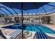 Inviting screened-in pool area with outdoor seating, with seamless flow to open floor plan and living spaces at 500 Halyard Ln, Longboat Key, FL 34228