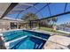 Stunning pool and backyard with lush landscaping, dock, and access to canal waterway at 500 Halyard Ln, Longboat Key, FL 34228