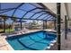 Enclosed pool and outdoor living space with covered seating area and canal views at 500 Halyard Ln, Longboat Key, FL 34228