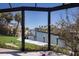 View of a waterfront property featuring a private boat dock on a scenic canal lined with homes at 500 Halyard Ln, Longboat Key, FL 34228