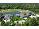 Beautiful aerial view of the property with a lake and golf course in the background at 5223 Chase Oaks Dr, Sarasota, FL 34241
