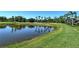 Beautiful backyard view of the pond and golf course, showing the home's proximity at 5223 Chase Oaks Dr, Sarasota, FL 34241