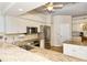 Bright kitchen featuring stainless steel appliances, light countertops, and ample white cabinetry at 5223 Chase Oaks Dr, Sarasota, FL 34241
