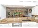 Open kitchen with granite countertops overlooking the living area at 5223 Chase Oaks Dr, Sarasota, FL 34241