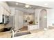 Modern kitchen with stainless steel appliances, granite countertops, and an adjacent breakfast nook at 5223 Chase Oaks Dr, Sarasota, FL 34241