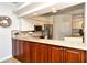 Updated kitchen with granite countertops, mosaic backsplash, and stainless steel appliances at 5223 Chase Oaks Dr, Sarasota, FL 34241