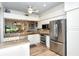 Modern kitchen with stainless steel appliances and white cabinets at 5223 Chase Oaks Dr, Sarasota, FL 34241