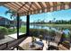 The lanai boasts a picturesque view of a serene lake and lush golf course beyond at 5223 Chase Oaks Dr, Sarasota, FL 34241