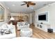 Bright living room featuring wood floors, modern furniture, and ample natural light at 5223 Chase Oaks Dr, Sarasota, FL 34241