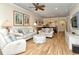 Comfortable living room featuring wood floors, modern furniture, and ample natural light at 5223 Chase Oaks Dr, Sarasota, FL 34241