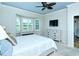 Inviting main bedroom with a bay window, dresser, and television at 5223 Chase Oaks Dr, Sarasota, FL 34241