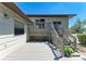 View of the spacious back deck with stairs leading up to the second level and lattice detail at 5311 San Jose Dr, Sarasota, FL 34235