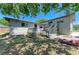 The back yard features a multilevel wooden deck, beautiful landscaping, and a privacy fence at 5311 San Jose Dr, Sarasota, FL 34235
