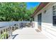 View of the upper level balcony and seating area with white privacy fence at 5311 San Jose Dr, Sarasota, FL 34235