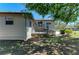 Backyard featuring a deck, landscaping, and a view of the property, perfect for outdoor entertaining at 5311 San Jose Dr, Sarasota, FL 34235