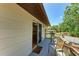 View of the outdoor balcony with a sliding glass door leading inside at 5311 San Jose Dr, Sarasota, FL 34235