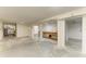 Unfinished basement space with concrete floors, white walls, workbench, and potential for storage or customization at 5311 San Jose Dr, Sarasota, FL 34235