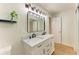 Bright bathroom featuring modern mirrors, updated sinks, and bright lighting at 5311 San Jose Dr, Sarasota, FL 34235