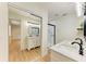 Bathroom featuring modern mirrors, updated sinks, and a glass shower at 5311 San Jose Dr, Sarasota, FL 34235