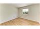 Bedroom featuring wood floors and a large window for natural light at 5311 San Jose Dr, Sarasota, FL 34235