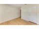 Bright bedroom featuring wood floors and a new door at 5311 San Jose Dr, Sarasota, FL 34235