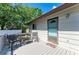 Outdoor space with a deck and seating, surrounded by lush trees at 5311 San Jose Dr, Sarasota, FL 34235