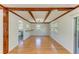 Charming dining room with wood floors, wooden beams, and ample natural light at 5311 San Jose Dr, Sarasota, FL 34235