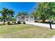 Charming two-story home with a front yard featuring white gravel and a convenient attached garage at 5311 San Jose Dr, Sarasota, FL 34235