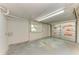 Insulated garage featuring a window, side door, and a insulated garage door at 5311 San Jose Dr, Sarasota, FL 34235