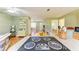 Open-concept kitchen with a cooktop island overlooking the living and dining areas, ideal for entertaining at 5311 San Jose Dr, Sarasota, FL 34235