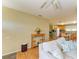 Living room view into kitchen, featuring hardwood floors and natural light at 5311 San Jose Dr, Sarasota, FL 34235