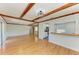 Bright living space with modern decor, wood floors, and an open layout to the kitchen at 5311 San Jose Dr, Sarasota, FL 34235