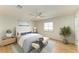 Serene bedroom features a comfortable bed, stylish decor, and a bright window for a relaxing retreat at 5311 San Jose Dr, Sarasota, FL 34235
