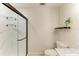 Luxurious shower featuring glass doors, marble-style walls, and modern fixtures at 5311 San Jose Dr, Sarasota, FL 34235